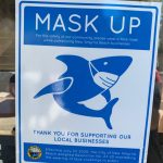 Cartoon shark promoting mask ussage