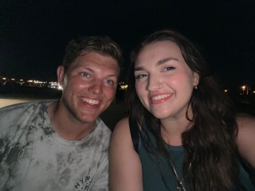 Man and Woman smiling at night