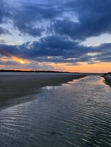 River sunset during low tide