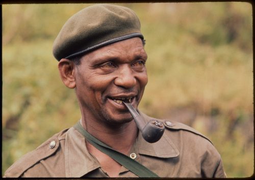 Congolese man smoking a pipe