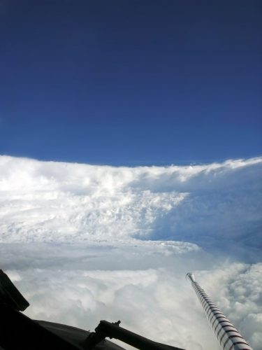 photo from the hurricane hunter plane of clouds forming the eyewall of a hurricane.
