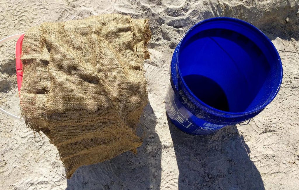 Strips of burlap and a bucket of water