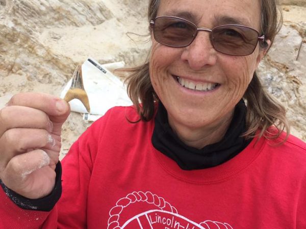 Dorelle Ackerman with the mako shark tooth she discovered on Sunday, April 8th. Florida Museum photo by Jonathan Bloch.