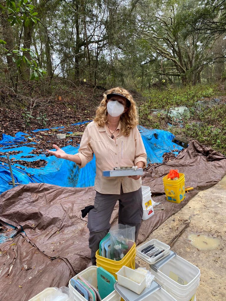 person standing next to buckets