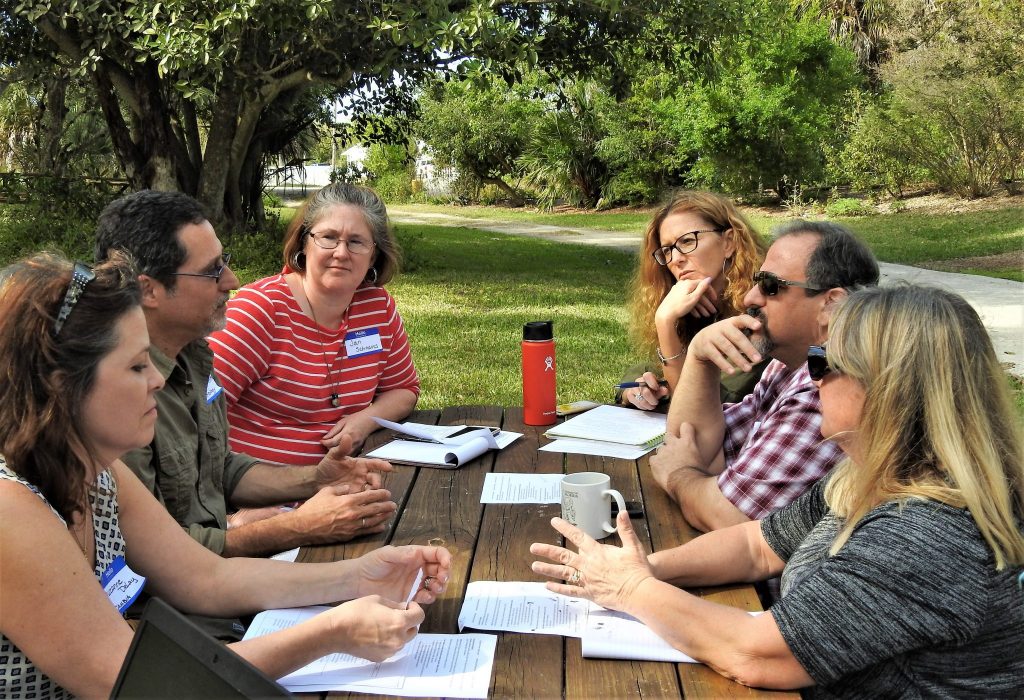 Teachers met in break-out groups to discuss how to implement the moonshot in their classroom.