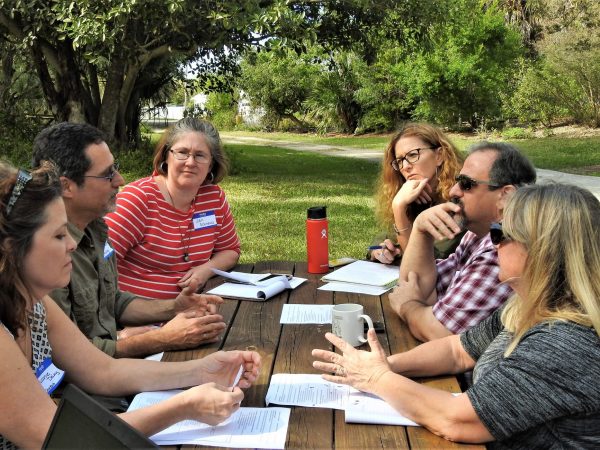 Teachers met in break-out groups to discuss how to implement the moonshot in their classroom.