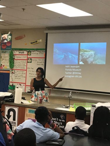 Scientist speaking with PowerPoint presentation