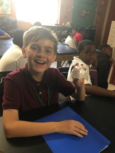 Student holding 3D bat print