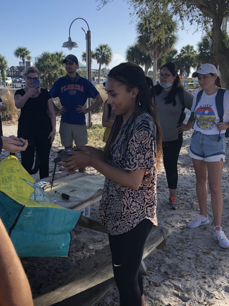 kayla weighing horseshoe crab