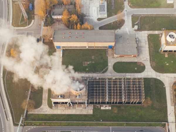 bird's-eye view of power plant with emissions