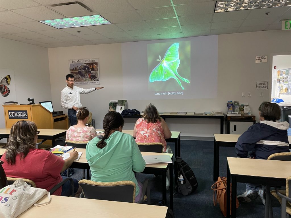 akito kawahara gives presentation on silk producing insects to classroom