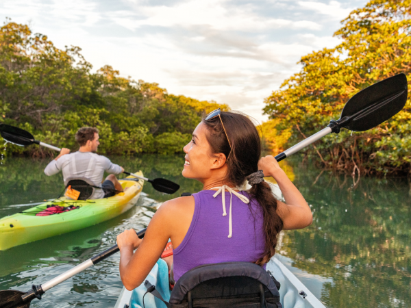 woman kayaking in floridian environment