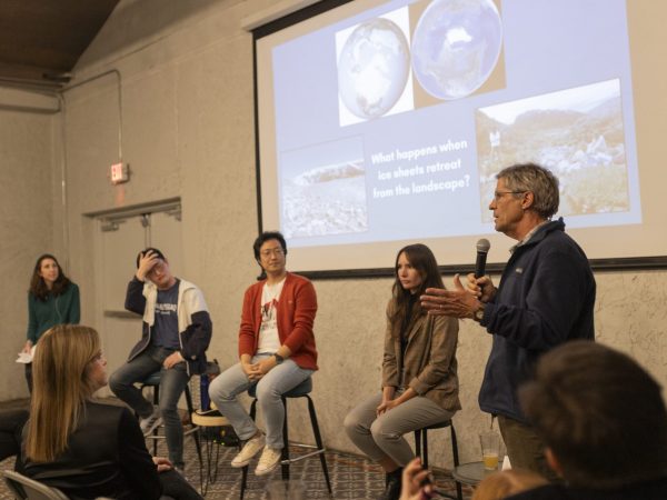 scientists talk about their research to an audience in a brewery