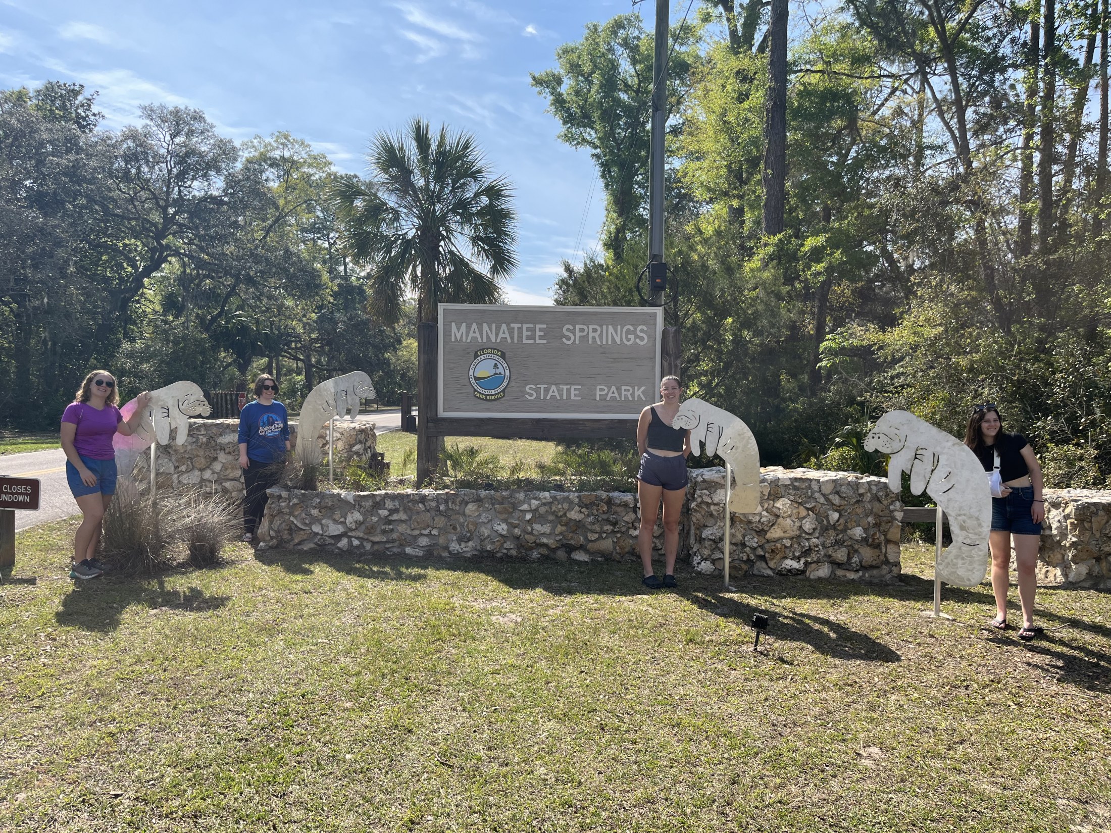 Group Photo in Front of Sign Springs Picture