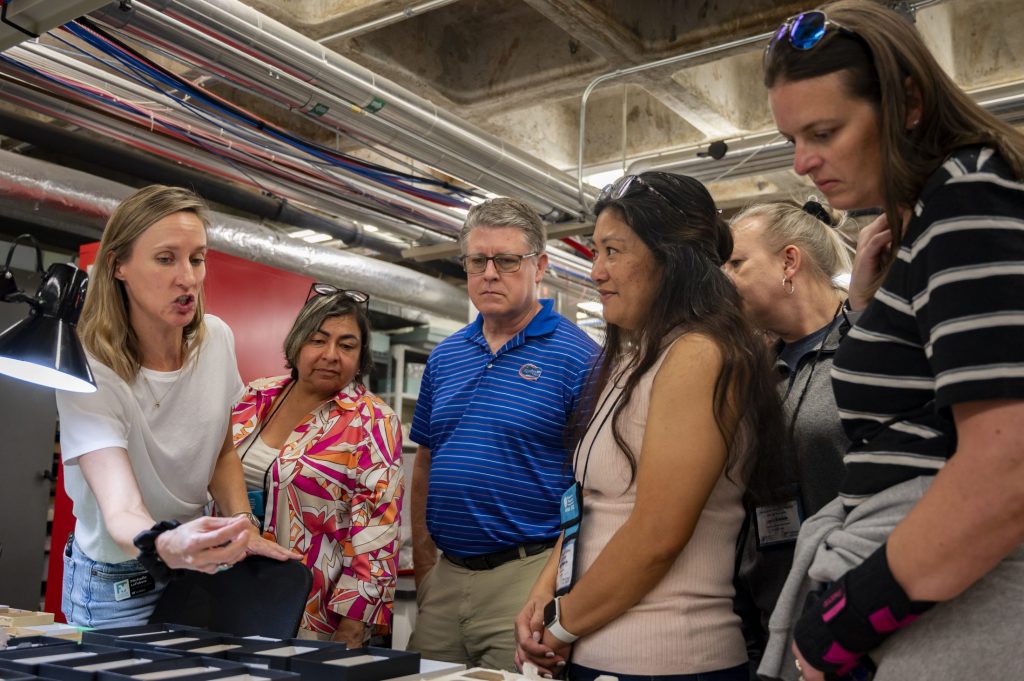 Michelle LeFebvre, Associate Curator of South Florida Archaeology & Ethnography, showing the teachers some specimens from South Florida.
