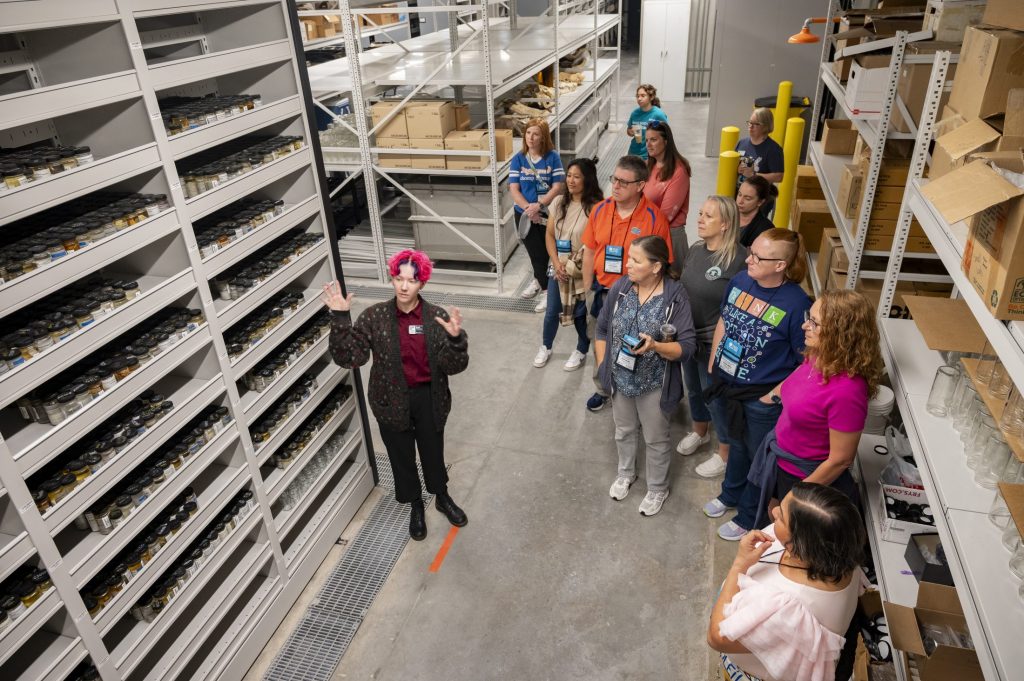 Basil Williams educates the teachers on the unique way the Ichthyology collection is sorted and catalogued.