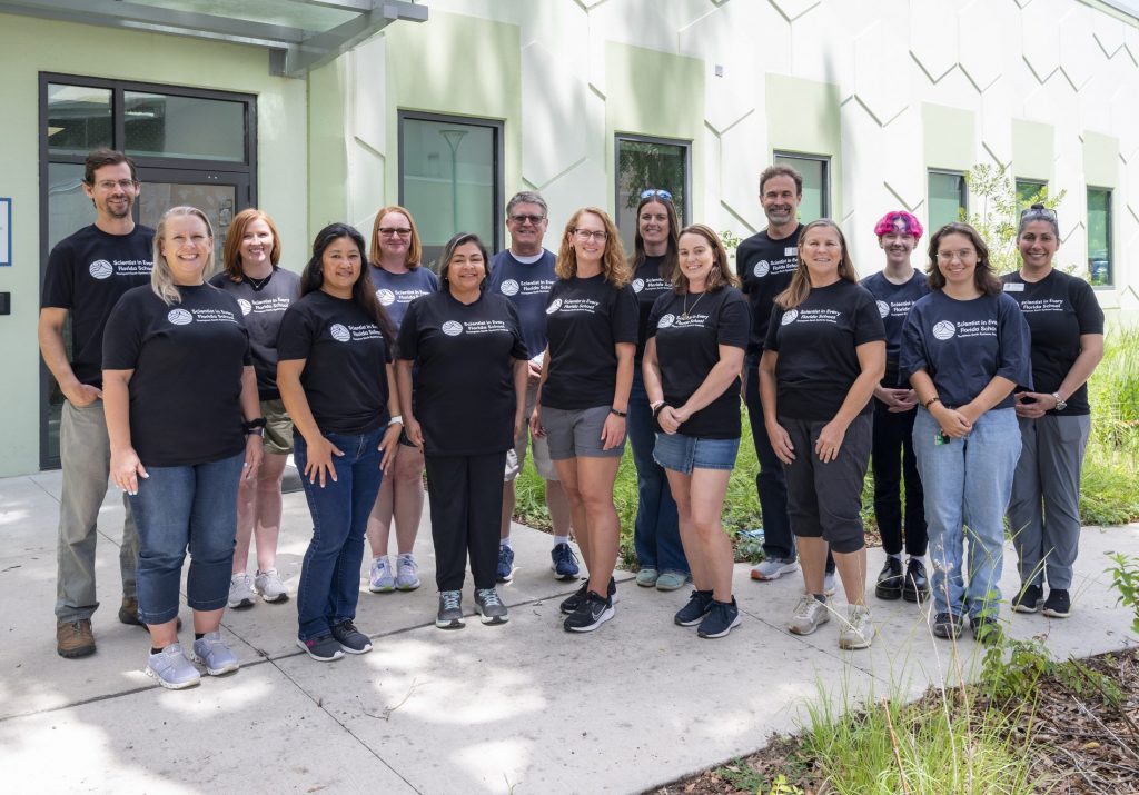 Group photo of the teachers outside of the museum's wet collections building.