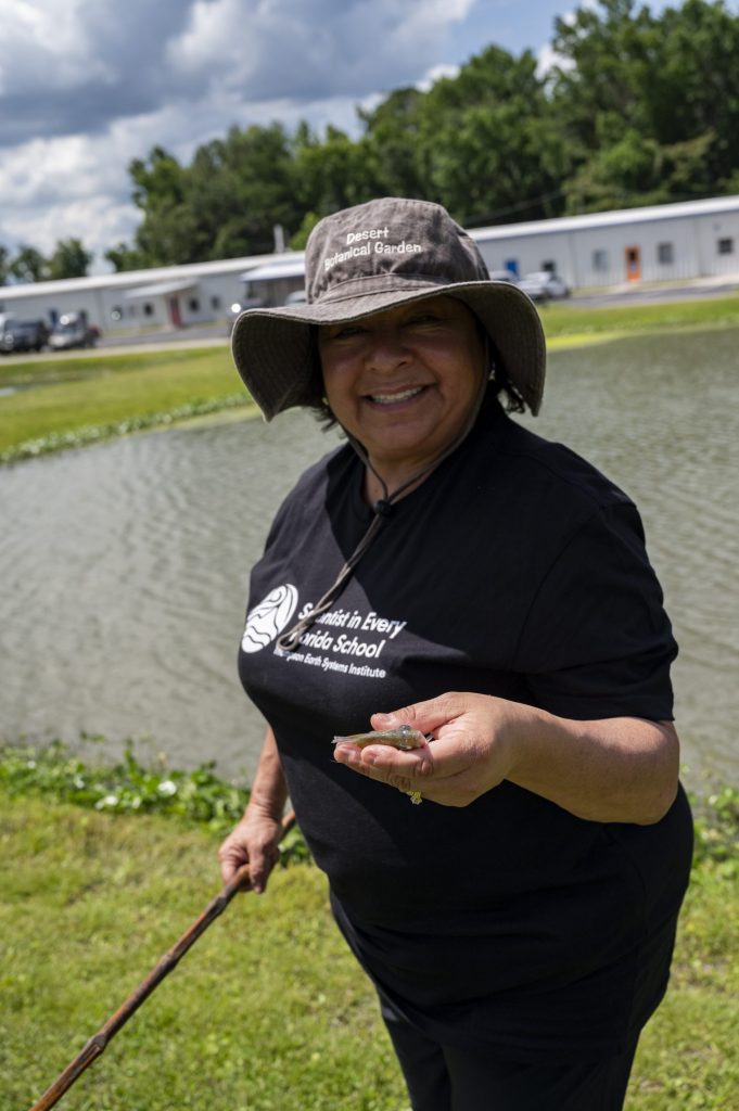 Maria Sandoval holding a fish she caught