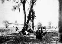 two women swing in a hammock