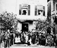 group photo in front of old shell shop