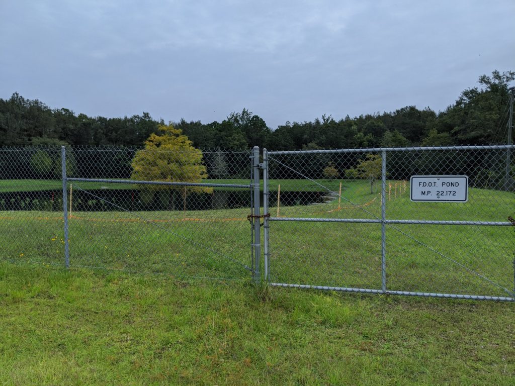 View of the gate of an FDOT retention basin.