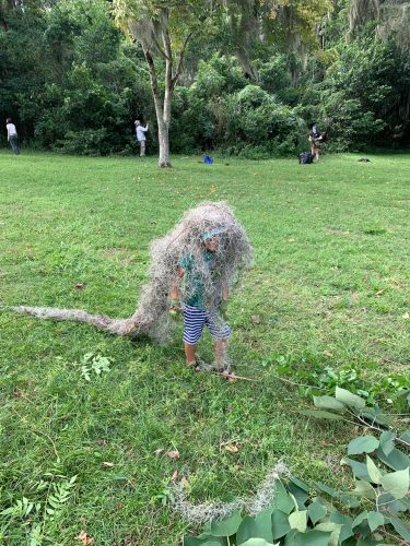 Moss man! Child helps with cleanup